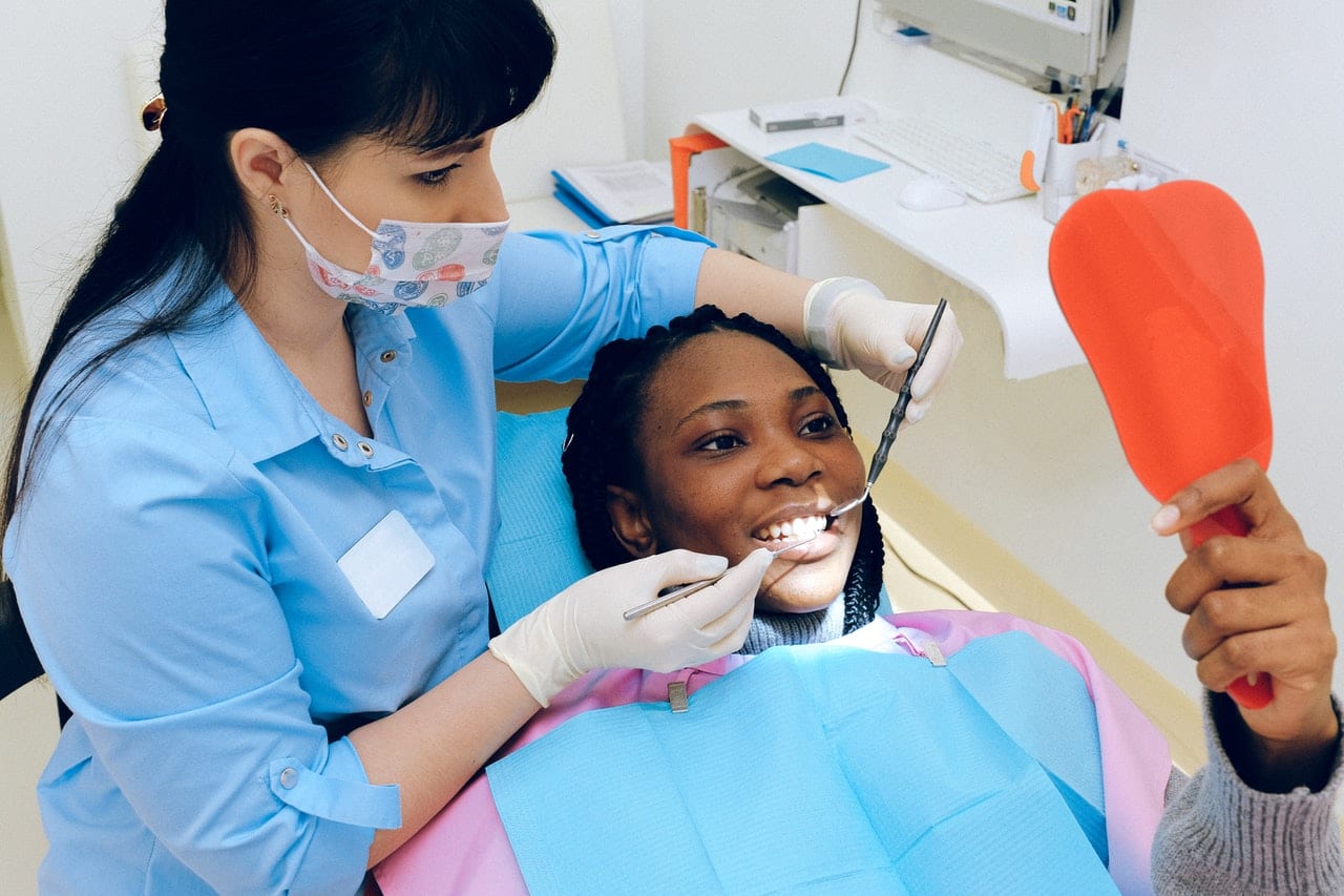 Dentist checking Patient